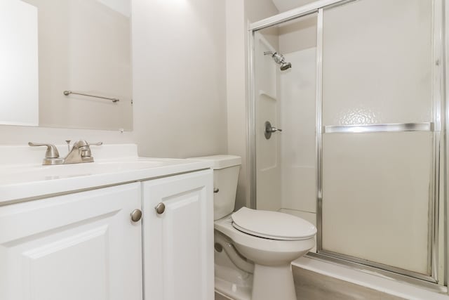 bathroom featuring vanity, toilet, an enclosed shower, and hardwood / wood-style flooring