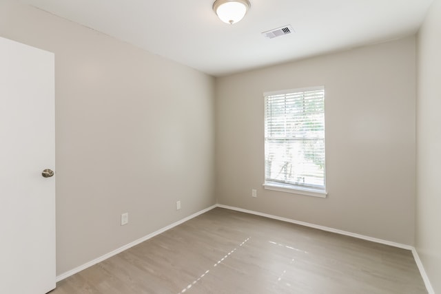 spare room featuring light hardwood / wood-style floors