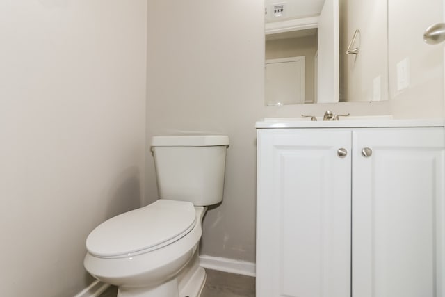 bathroom with toilet and vanity