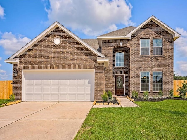 front of property with a garage and a front yard