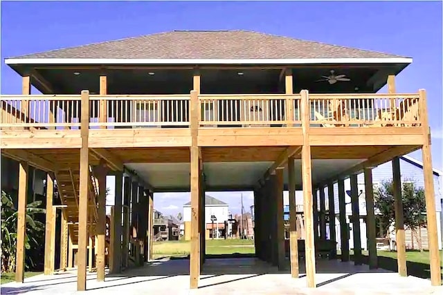 rear view of house featuring ceiling fan