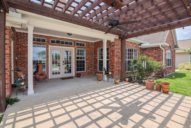 view of patio with french doors, a pergola, and ceiling fan