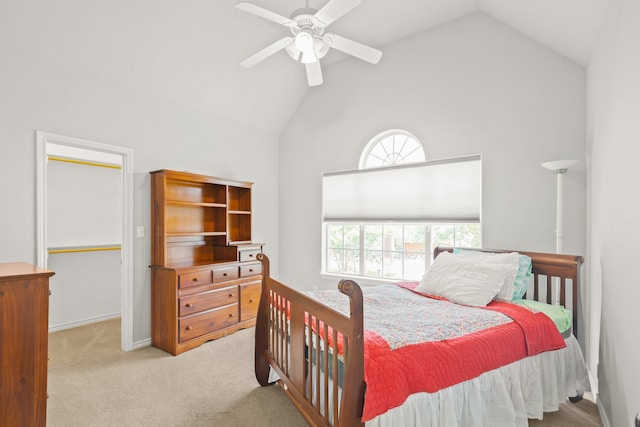 carpeted bedroom with high vaulted ceiling and ceiling fan