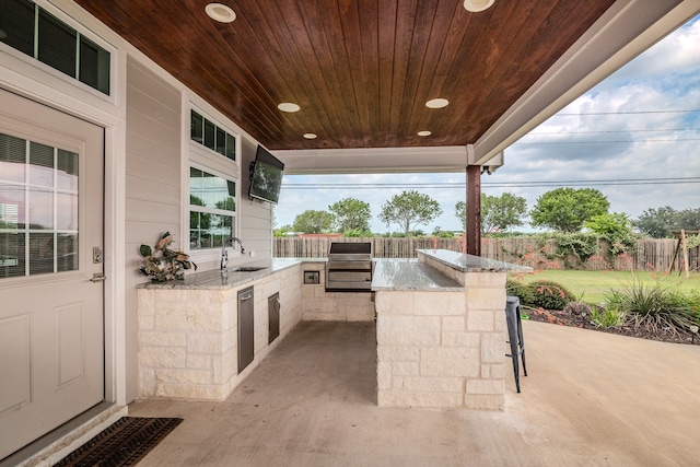 view of patio / terrace with area for grilling and sink