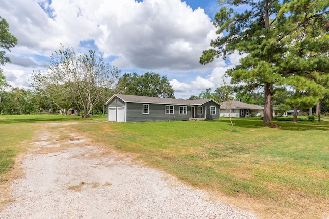 view of front facade with a garage and a front lawn