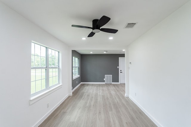 empty room featuring ceiling fan and light wood-type flooring