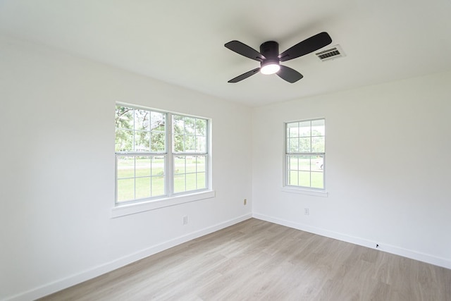 unfurnished room featuring ceiling fan and light wood-type flooring