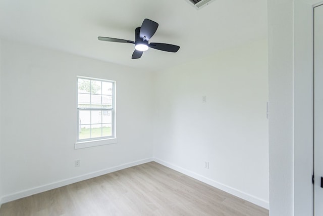 empty room featuring ceiling fan and light wood-type flooring