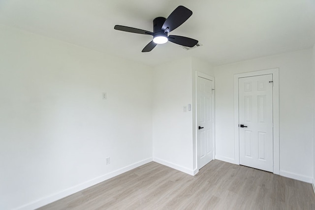 unfurnished bedroom with ceiling fan and light hardwood / wood-style floors