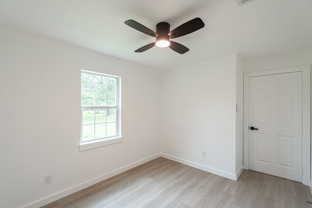 spare room with ceiling fan and light hardwood / wood-style floors