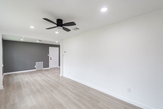 spare room with light hardwood / wood-style flooring and ceiling fan