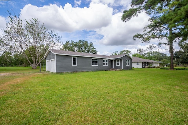 exterior space with a lawn and a garage