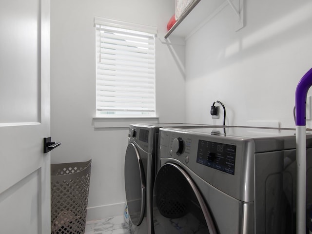 washroom featuring washer and dryer