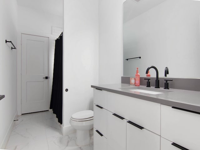 bathroom with vanity and toilet