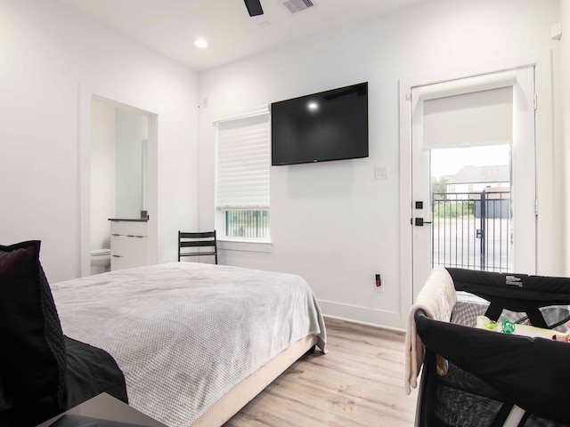 bedroom featuring light hardwood / wood-style flooring, multiple windows, access to exterior, and ceiling fan