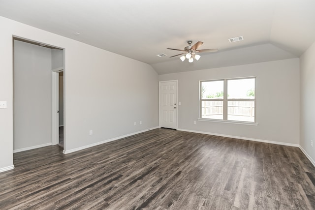 unfurnished room featuring ceiling fan, dark hardwood / wood-style flooring, and vaulted ceiling