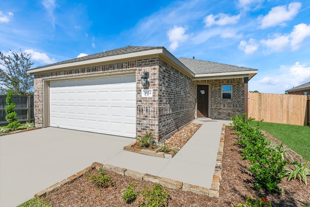 single story home featuring a garage