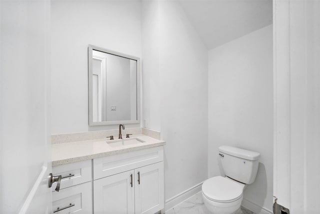 bathroom featuring vanity, toilet, and tile patterned floors