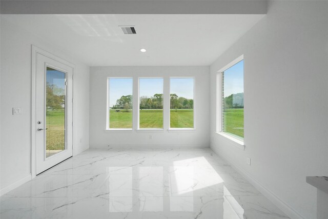 empty room with light tile patterned flooring