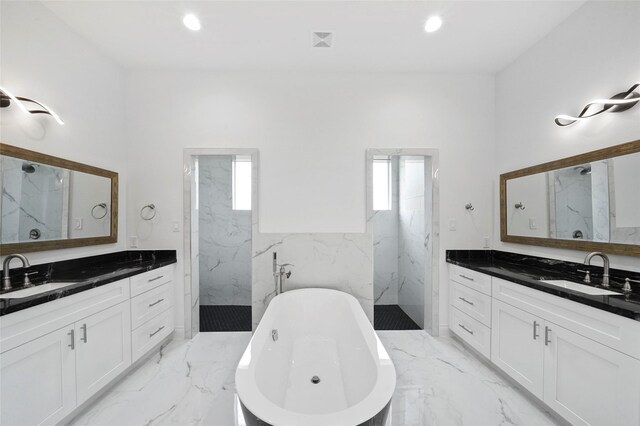 bathroom with plus walk in shower, vanity, and tile patterned floors