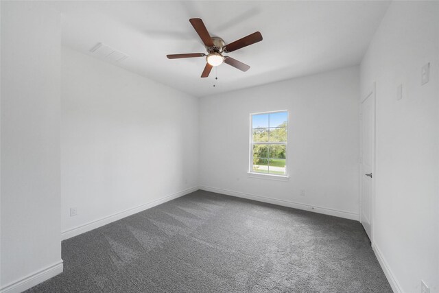 spare room featuring ceiling fan and carpet floors