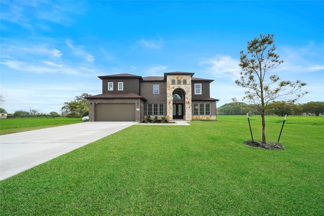 view of front facade with a garage and a front lawn