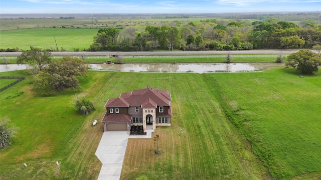 aerial view featuring a rural view and a water view