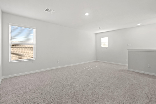 empty room featuring light colored carpet