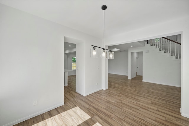 unfurnished dining area with wood-type flooring