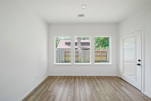 interior space featuring a wealth of natural light and light hardwood / wood-style floors