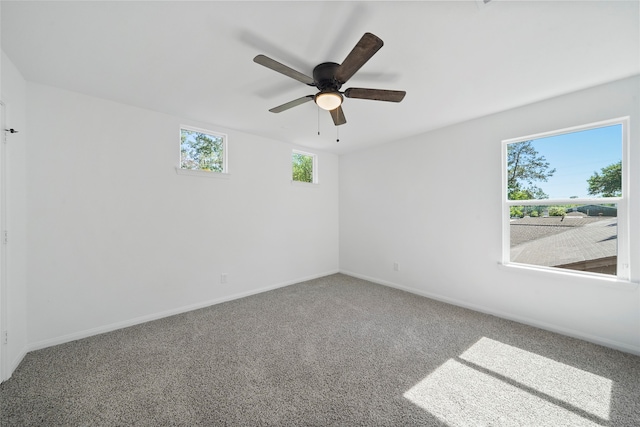 carpeted empty room with ceiling fan