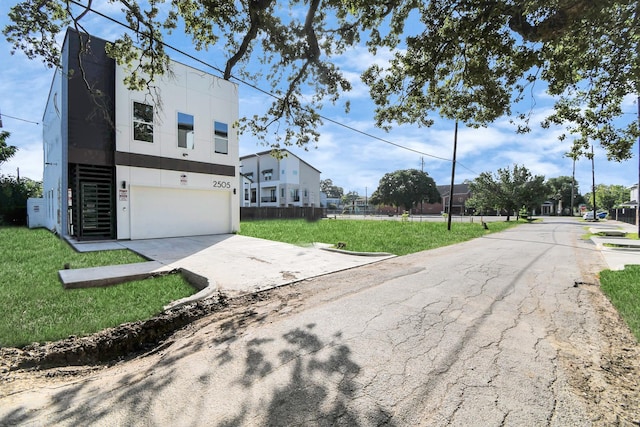 exterior space with a yard and a garage