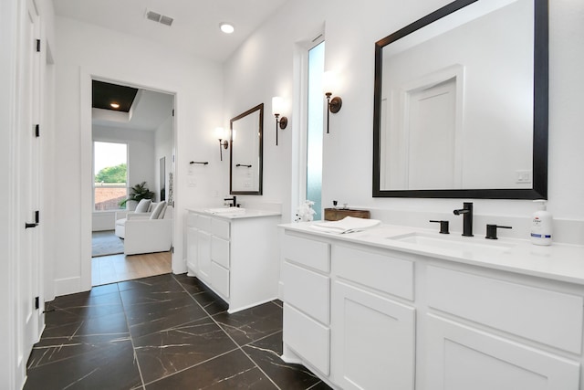 bathroom featuring vanity and hardwood / wood-style flooring