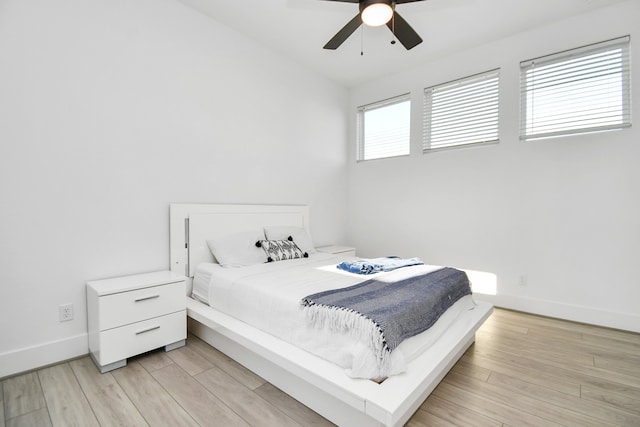 bedroom featuring ceiling fan and light hardwood / wood-style flooring