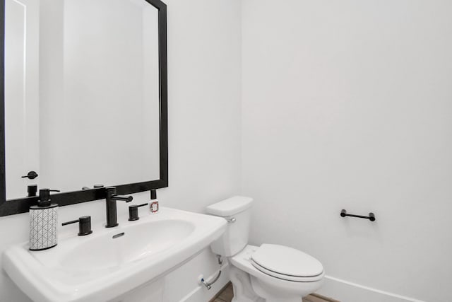 bathroom with toilet and sink