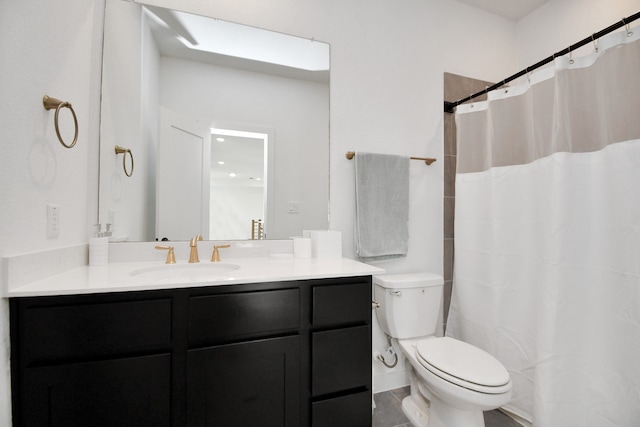 bathroom featuring vanity, toilet, a shower with curtain, and tile patterned floors