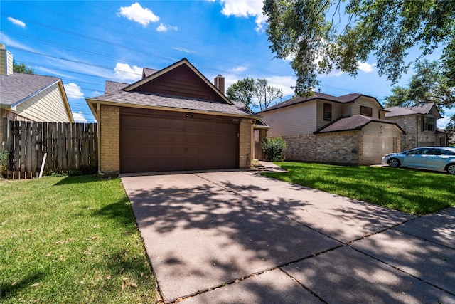 view of front facade with a front yard and a garage