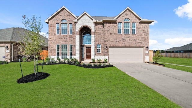 front facade featuring a garage and a front yard