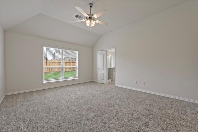 unfurnished room featuring lofted ceiling, ceiling fan, and carpet floors