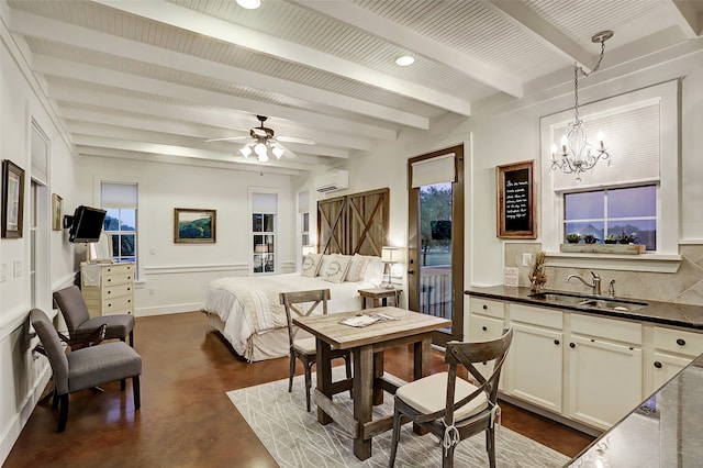 bedroom featuring sink, a wall unit AC, multiple windows, and beam ceiling