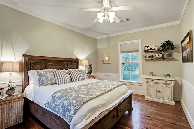 bedroom with crown molding, ceiling fan, and dark hardwood / wood-style floors