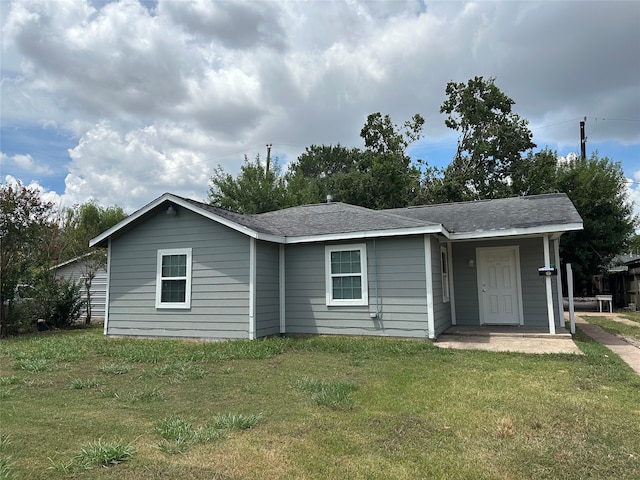 ranch-style home with a front lawn