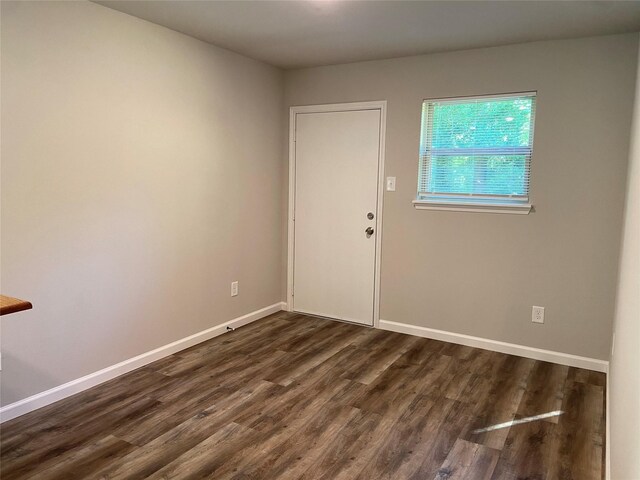 empty room featuring dark hardwood / wood-style floors