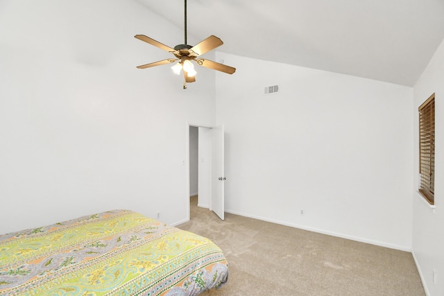 carpeted bedroom featuring high vaulted ceiling and ceiling fan