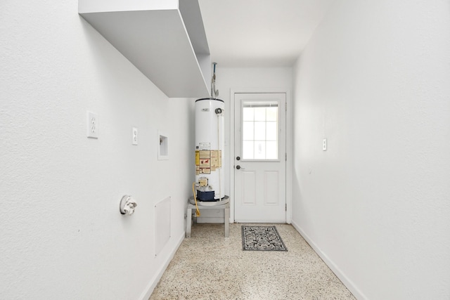 doorway to outside featuring gas water heater