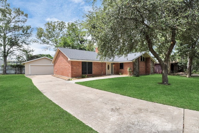 ranch-style home featuring a front yard and a garage