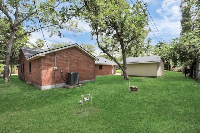 view of yard with central air condition unit