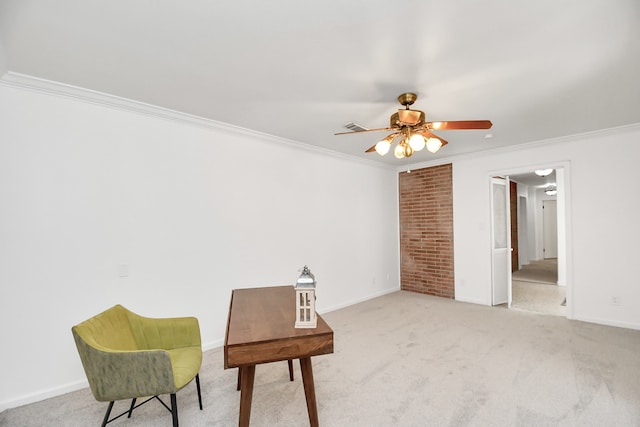 sitting room featuring carpet, crown molding, and ceiling fan