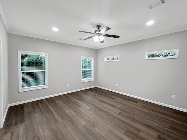 spare room featuring ceiling fan, dark hardwood / wood-style flooring, and ornamental molding