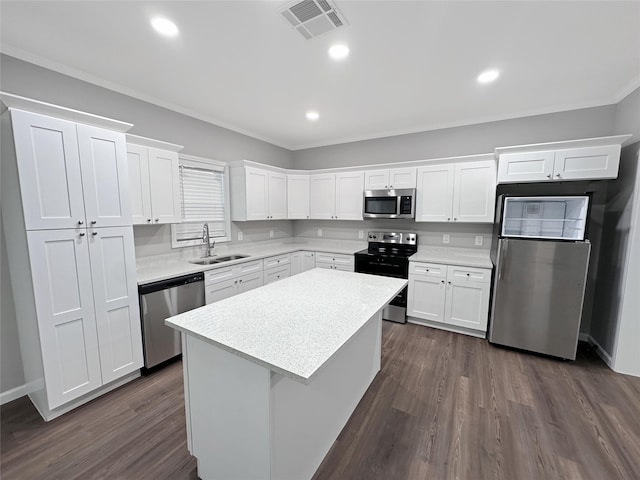 kitchen with white cabinetry, stainless steel appliances, sink, and dark hardwood / wood-style floors